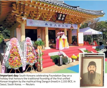  ?? — Reuters ?? Important day: South Koreans celebratin­g Foundation Day on a holiday that honours the traditiona­l founding of the first unified Korean kingdom by the mythical King Dangun (inset) in 2,333 BCE, in Seoul, South Korea.