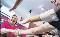  ?? AP PHOTO ?? Democratic presidenti­al candidate Hillary Clinton greets supporters as she arrives for a rally in Philadelph­ia Friday.