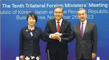  ?? Ahn Young-joon Pool Photo ?? FOREIGN MINISTERS Yoko Kamikawa of Japan, from left, Park Jin of South Korea and Wang Yi of China agreed to pursue cooperatio­n in areas including people-to-people exchange, trade, technology and security.