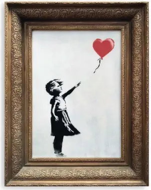  ?? The Associated Press ?? GIRL WITH BALLOON: In this undated photo provided by Sotheby’s the spray-painted canvas ‘Girl with Balloon’ by artist Banksy is pictured. A work by the elusive street artist self-destructed in front of startled auction-goers on Friday, moments after being sold for 1.04 million pounds ($1.4 million).