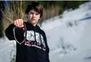  ?? Idaho. Photograph: Jordon Beesley/AP ?? Canyon Mansfield holds the collar of his dog, Casey, who was killed by a cyanideeje­cting device placed on public land near his home in Pocatello,