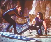  ?? Robert Zuckerman Paramount ?? FONDA’S career was varied. In “Escape From L.A.,” he portrayed a surfer dude. At right is Kurt Russell.