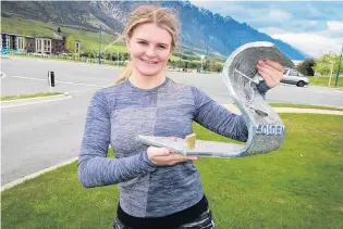  ?? PHOTO: PHILIP CHANDLER ?? Winner . . . Alice Robinson back in Queenstown yesterday with her trophy.