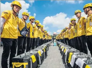  ?? PROVIDED TO CHINA DAILY ?? Employees of Meituan-Dianping have a morning-meeting before commenceme­nt of work in Guilin, the Guangxi Zhuang autonomous region.