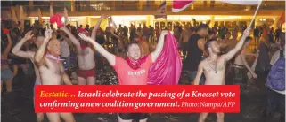  ?? Photo: Nampa/AFP ?? Ecstatic… Israeli celebrate the passing of a Knesset vote confirming a new coalition government.