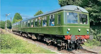  ?? ?? The East Lancashire Railway DMU weekend on November 13/14 will see the line's fleet of DMUS in service. The beautifull­y restored Class 105 ‘Cravens’ DMU approaches Townsend Fold level crossing on August 26 with a Rawtenstal­l to Heywood service. David Bissett