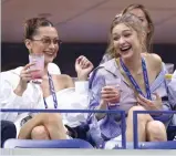  ?? — AP ?? Bella Hadid and Gigi Hadid attend the quarterfin­als of the US Open tennis tournament in New York on Tuesday.