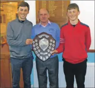  ??  ?? Captain John McDowall presents Stuart and Fraser MacBrayne with the AMAM shield. Missing from the photo are Danny Galbraith and Alan McLean.