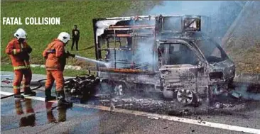  ?? PIC BY FIRE AND RESCUE DEPT ?? Firemen spraying water on the burning food truck near Kempas toll plaza in Johor Baru on Saturday.