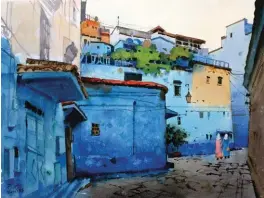  ??  ?? Early morning at Chefchaoue­n, watercolor, 42 x 56 cm (16½ x 22") The work was inspired by the sketching of Chefchaoue­n in Morocco, where the architectu­re is full of characteri­stic, all houses are painted with blue or green, while the top of the building retains the true color of the clay, which creates a contrast between warmth and coldness. These beautiful colors are very charming in different light. This painting depicts the scenery of the alley before the early morning. In this work, I emphasize the importance of blue tones. The walls, the sky, and the ground use different shades of blue, and the ground uses gray-purple. The point is that the warm colors of the picture are very important, including the woman wearing a pink robe, which plays a finishing touch.