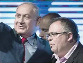  ??  ?? DAVID BITAN, right, with Netanyahu in August, faces charges of fraud, breach of trust and graft relating to his time as deputy mayor of a Tel Aviv suburb.