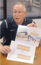  ?? GREG SORBER/JOURNAL ?? Dan Serrano, executive director of the Albuquerqu­e Youth Basketball League, displays plans for a proposed, 10-court facility. The AYBL begins its 39th season on Saturday.