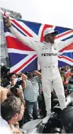  ?? AFP/GETTY IMAGES ?? British driver Lewis Hamilton celebrates after winning his fourth Formula One world title despite finishing ninth in the Mexican Grand Prix.