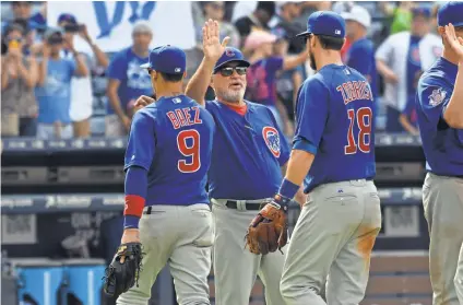  ?? DALE ZANINE, USA TODAY SPORTS ?? Manager Joe Maddon, center, says he’ll be proud to see the NL’s Cubs-heavy All-Star lineup.