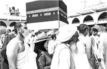  ??  ?? HOLY MONTH: Muslim pilgrims circle the Kaaba and pray at the Grand mosque during the annual haj pilgrimage in the holy city of Mecca, Saudi Arabia. — Reuters photo