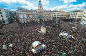  ?? David Ramos / Getty Images ?? Supporters of leftist party Podemos fill Madrid’s town square. “This is the year for change, and we’re going to win the elections,” the party’s founder said.