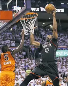  ??  ?? Houston center Nene goes up against Oklahoma City guard Victor Oladipo in the Rockets’ win Sunday in Game 4. Nene scored 28 points, making all 12 of his shots.