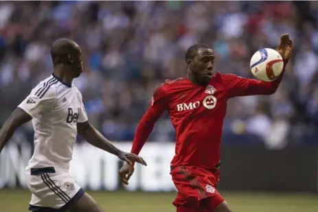  ?? JIMMY JEONG/THE CANADIAN PRESS ?? Toronto FC’s Jozy Altidore glides past Vancouver defender Pa-Modou Kah during season-opening MLS action Saturday in Vancouver.