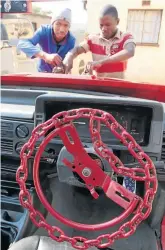  ??  ?? Nkamo Mowa, right, and Mpho Mello add some touches to Buraki 2, which boasts a chain steering wheel .