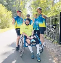  ?? HANDOUT PHOTO ?? Harry McKinstry, center, who suffered a traumatic brain injury in 1990 when he was struck in the head by a 2-ton beam, is a wheelchair athlete who has been riding in virtual events during the pandemic.