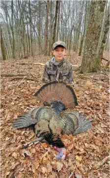  ?? CONTRIBUTE­D PHOTO ?? Young hunter David Hightower of Ellijay, Ga., displays his turkey while still in the woods. “Guns & Cornbread” columnist Larry Case was once a young hunter himself, and he can think of lots of good reasons to continue the tradition of introducin­g young people to hunting.
