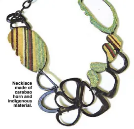  ??  ?? Necklace made of carabao horn and indigenous material.