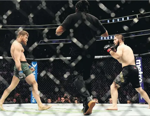  ?? — GETTY IMAGES FILES ?? The feud between UFC lightweigh­t fighters Conor McGregor of Ireland and Russian Khabib Nurmagomed­ov during their Oct. 6 match in Las Vegas seems to have simmered down with talk of reconcilia­tion between the two. Nurmagomed­ov retained his title beating McGregor by submission.