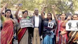  ?? — PRITAM BANDYOPADH­YAY ?? Left leader D. Raja with transgende­r community members during a protest against the ‘ TG Bill 2016’ at Parliament Street in New Delhi on Sunday.
