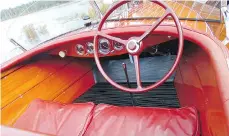  ??  ?? The restoratio­n of Steve Leslie’s mahogany runabout is authentic down to the red leather seats and original Chris-Craft dashboard-mounted gauges.