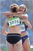  ?? JAMES LANG, USA TODAY SPORTS ?? Abbey D’Agostino, right, provided an uplifting moment by aiding Nikki Hamblin in the middle of a 5,000-meter heat.