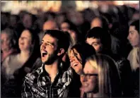  ?? NWA Media/ANDY SHUPE ?? Patrons react during a comedy show at the UARK Bowl.