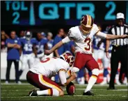 ?? AP PHOTO ?? Washington Redskins kicker Dustin Hopkins (3) boots one of his five game field goals.