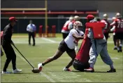  ?? JOSIE LEPE — BAY AREA NEWS GROUP ?? Niners defensive end Drake Jackson, left, runs drills during rookie minicamp at Levi's Stadium in Santa Clara on Friday.