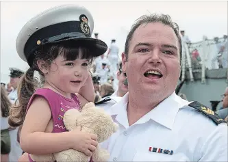  ?? ANDREW VAUGHAN THE CANADIAN PRESS ?? Petty Officer Second Class Robert Sinclair holds daughter Harper, as HMCS St. John’s returns to port in Halifax on Monday. The ship and crew were participat­ing in Operation Reassuranc­e, which aims to reinforce NATO’s collective defence. Exercises took...