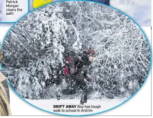  ??  ?? DRIFT AWAY Boy has tough walk to school in Antrim