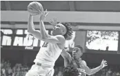  ?? BRYNN ANDERSON/AP ?? Alabama guard Dazon Ingram shoots against Kentucky guard Malik Monk on Feb. 11 in Tuscaloosa, Ala.