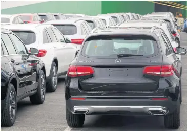  ?? AFP ?? Mercedes-Benz GLC 220d cars wait to be shipped at the harbour in Bremerhave­n, northern Germany.