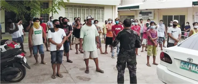  ??  ?? ILLEGAL COCKFIGHT. Around 53 residents from Barangay Kalanan, Tabogon town, were arrested on June 29, 2020 after they were caught holding an illegal cockfight. Also arrested was the barangay chief who allowed the cockpit to operate. /