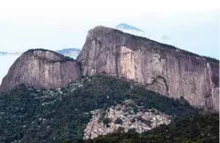  ??  ?? The Rocinha favela and the Dois Irmaos hill are seen from a hiking trail - part of a projected 8,000-kilometer trail across Brazil, which will be one of the longest in the Americas- in Rio de Janeiro, Brazil. — AFP photos