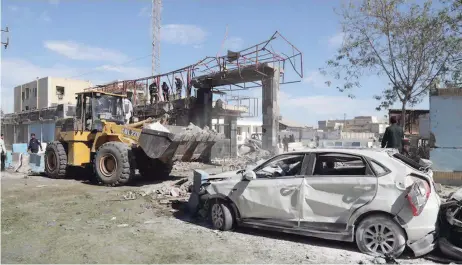  ??  ?? A general view of the scene of a car bombing in front of a police station in the city of Chabahar in southern Iran. — AFP