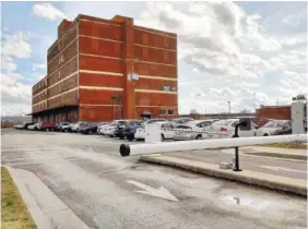  ?? STAFF FILE PHOTO ?? A gate controls access to a city-owned parking lot at 1200 King St. Developers Hiren Desai and Jimmy White offered to pay $134,700 for the parking lot — less than the $195,000 paid a decade ago for it. The city will hang on to the land, after all, and...