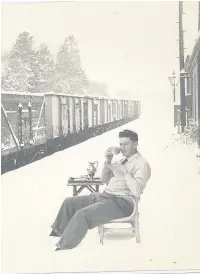  ??  ?? Pictured is Charles Matthews enjoying a cup of coffee in the snow at Shepshed railway station, ‘practicing for the summer’ according to Charles. Photo sent in by Looking Back reader Jim Matthews.