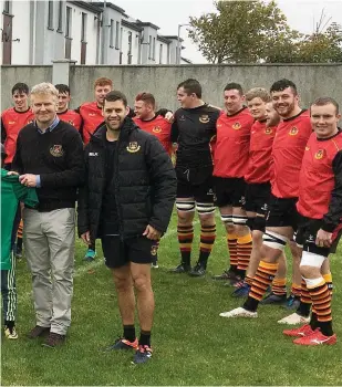  ??  ?? Clockwise from above: Kuba Wojtkowicz presents his Ireland U-20 jersey to chairperso­n Niall Gray; Phillip Carter wins possession; the club’s senior players with Mairead and Aoibheann Mitchell following a fundraiser; Ciaran Cassidy reaches for the ball