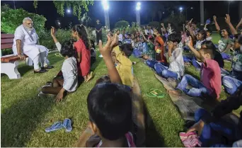  ?? — PTI ?? Prime Minister Narendra Modi interacts with children from Kashi Vidyapith as part of his 68th birthday celebratio­ns in Varanasi on Monday.