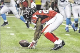  ?? DAVID GOLDMAN / AP ?? Running back Devonta Freeman and the Falcons have had trouble holding onto the ball this season, not to mention too few takeaways from the defense.