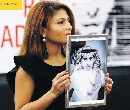  ?? CHRISTIAN LUTZ/AP PHOTO, FILE ?? Ensaf Haidar holds a picture of her husband, jailed Saudi blogger Raif Badawi, whose activist sister is now being detained in Saudi Arabia.