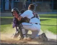  ?? THOMAS NASH - DIGITAL FIRST MEDIA ?? Cole Eggleston collides with Spring City catcher Ryan Harvey during the top of the fourth inning.