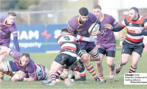  ??  ?? Charge Greg Peterson charges at the Stirling defence.
Pictures: Ken Ferguson