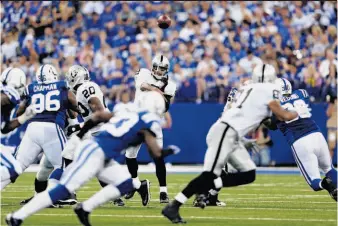  ?? Andy Lyons / Getty Images ?? Raiders quarterbac­k Terrelle Pryor completed 19 passes for 217 yards and a touchdown, and he also was a threat when he kept the ball, running for a game-high 112 yards.