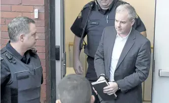  ?? ANDREW VAUGHAN/THE CANADIAN PRESS ?? Dennis Oland heads from court in Fredericto­n in 2016. The Supreme Court of Canada says Dennis Oland was wrongly denied bail pending an appeal of his second-degree murder conviction. The high court decision today could have influence beyond the...